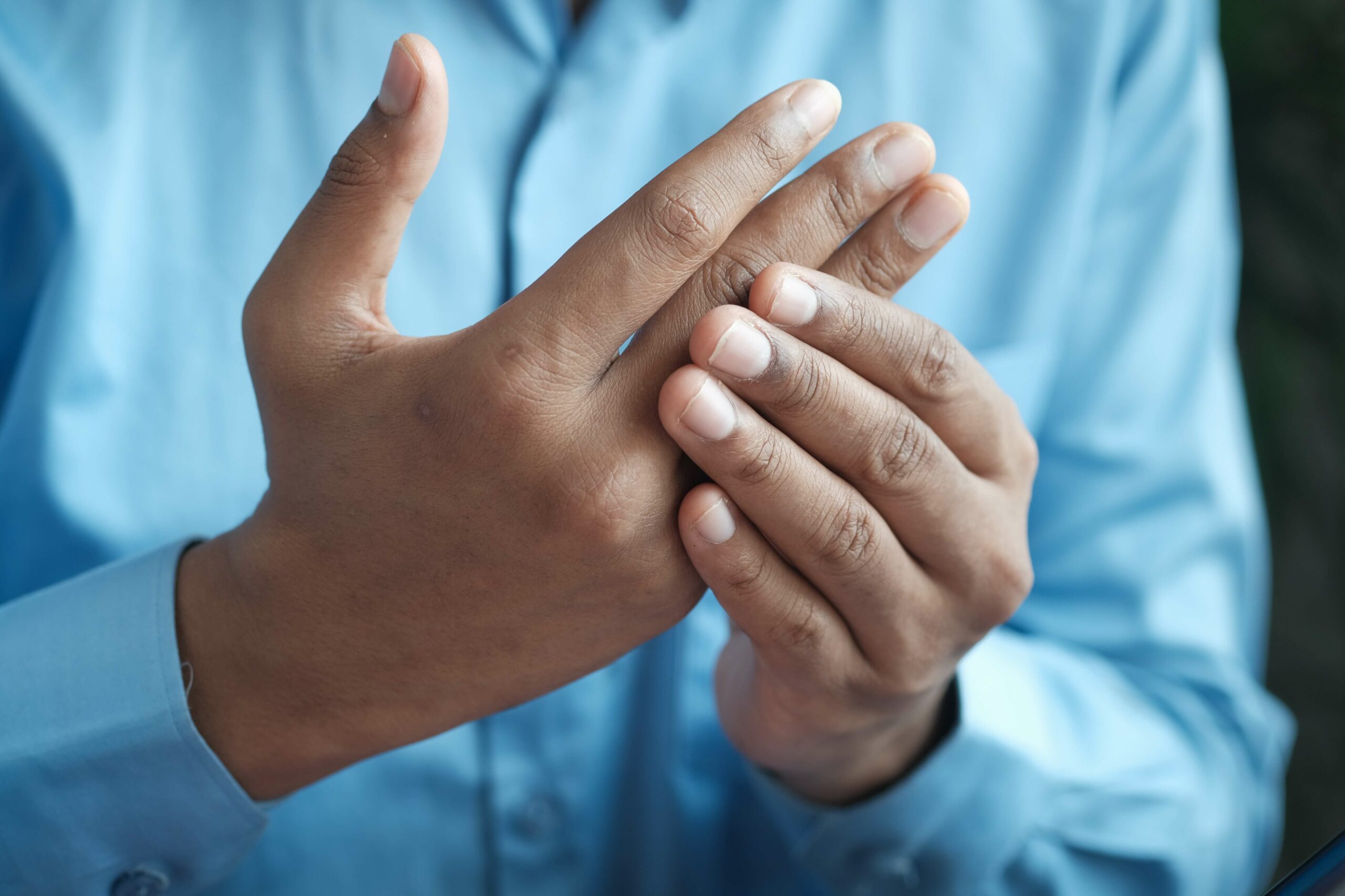 Person massaging their hand